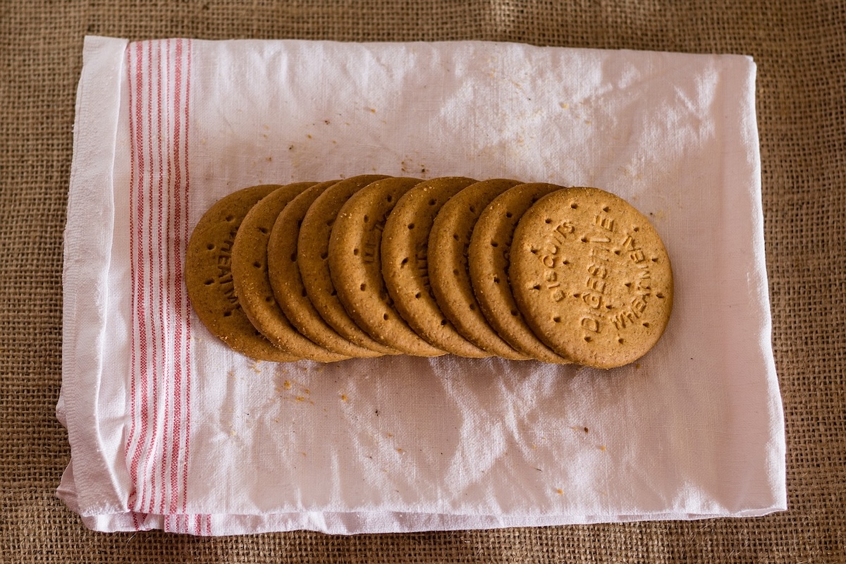 several digestive biscuits on a tea-towel.