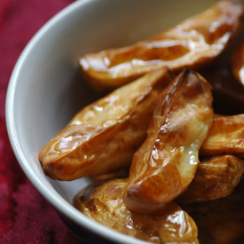 a dish of potato wedges 