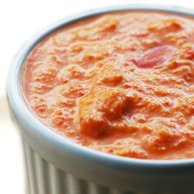 a small dish of red pepper hummus