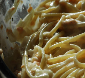 smoked salmon pasta in a bowl, close up shot