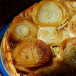 A close up image of an onion tarte tatin