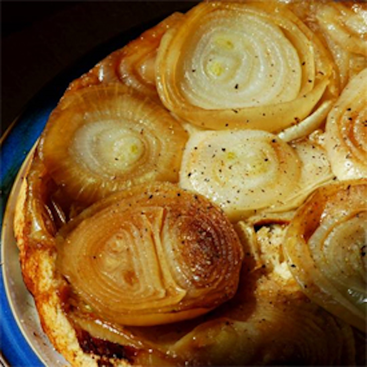 A close up image of an onion tarte tatin