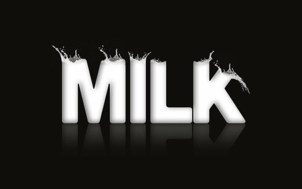 a graphic image spelling out the work 'milk' with splashes above each letter