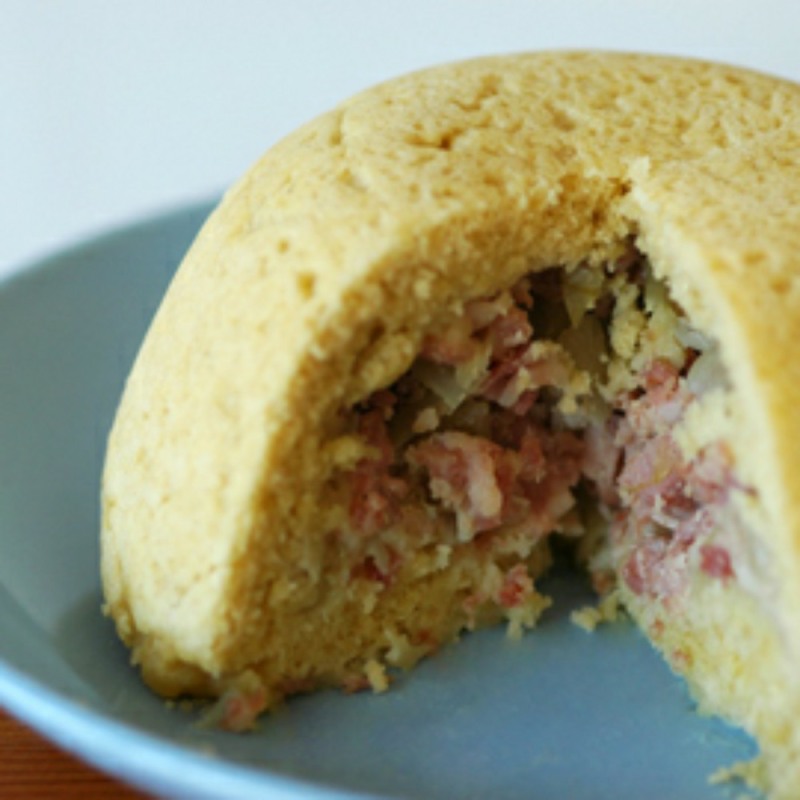 bacon pudding on a blue plate