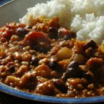 chilli mince, with white rice, on a blue plate